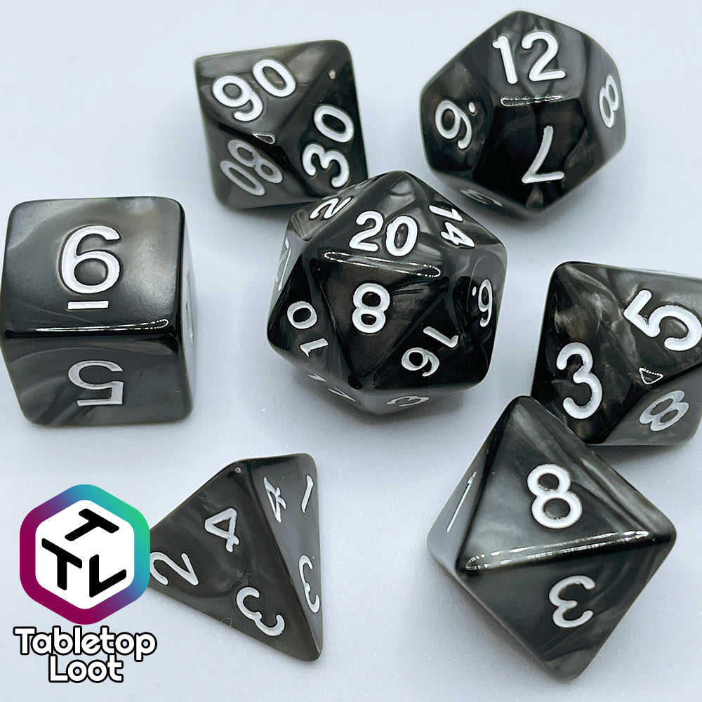 The Black Pearl 7 piece dice set with pearlescent black swirls and silver numbering.