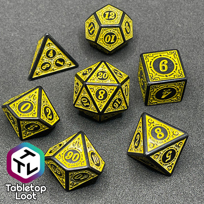 A close up of the Lament Configuration 7 piece dice set from Tabletop Loot with black borders, swirls, and stars and a bright yellow relief and numbering.