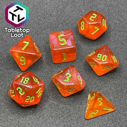 The Cyber Punk'in 7 piece dice set from Tabletop Loot; glittery orange with neon green gothic numbering.