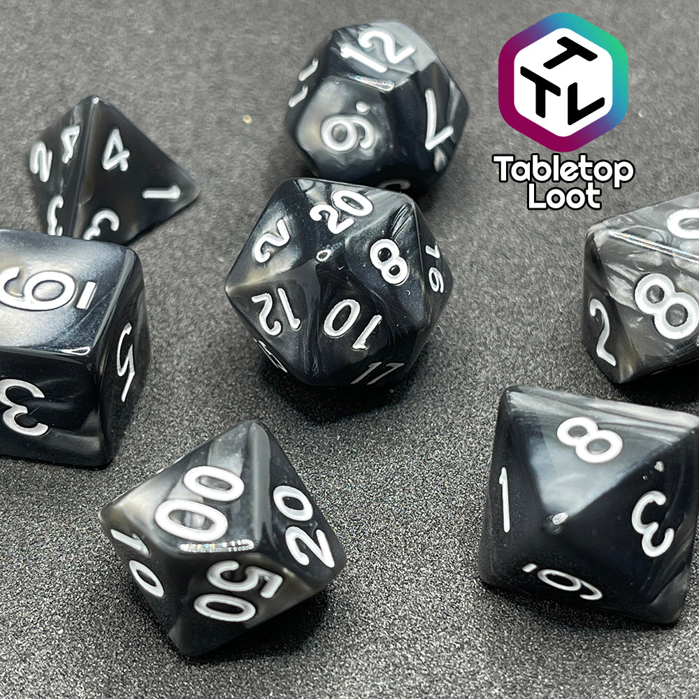 The Black Pearl 7 piece dice set with pearlescent black swirls and silver numbering.