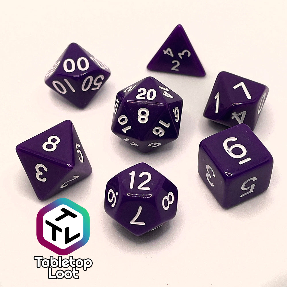 The Blackberries 7 piece dice set; solid purple with white numbering.
