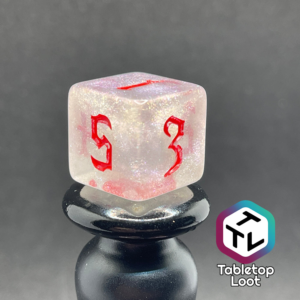 Translucent d6 with iridescent micro-glitter and red numbers.