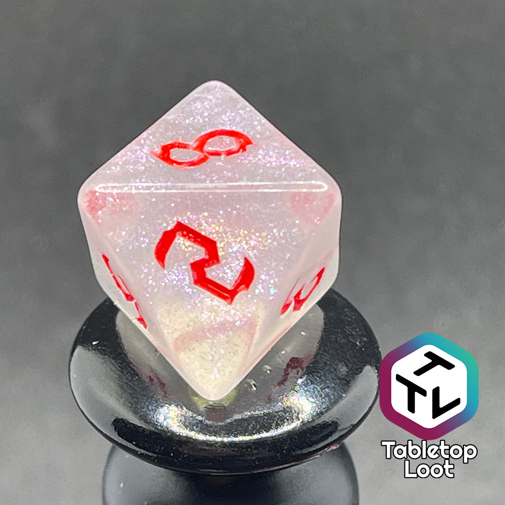 Translucent d8 with iridescent micro-glitter and red numbers.
