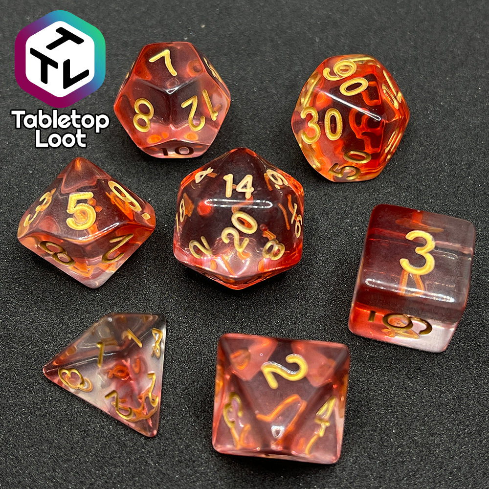 The Blood Hunter 7 piece dice set from Tabletop Loot with swirled red and clear resin and gold numbering.