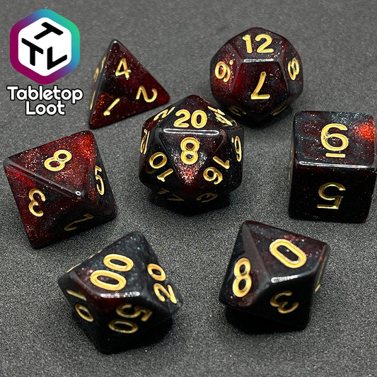 The Blood Lust 7 piece dice set from Tabletop Loot with swirls of dark glittery red which looks almost black and gold numbering.