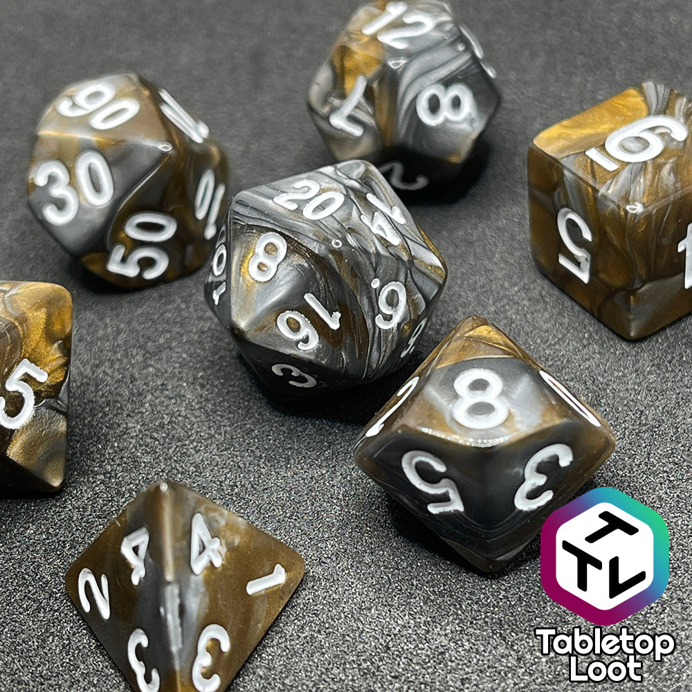 The Bronze Dragon 7 piece dice set from Tabletop Loot with swirls of pearlescent bronze and silver and silver numbering.