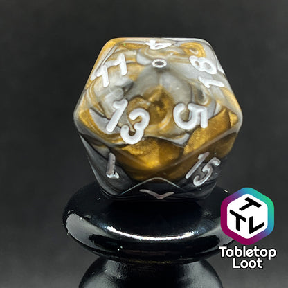 A close up of the D20 from the Bronze Dragon 7 piece dice set from Tabletop Loot with swirls of pearlescent bronze and silver and silver numbering.