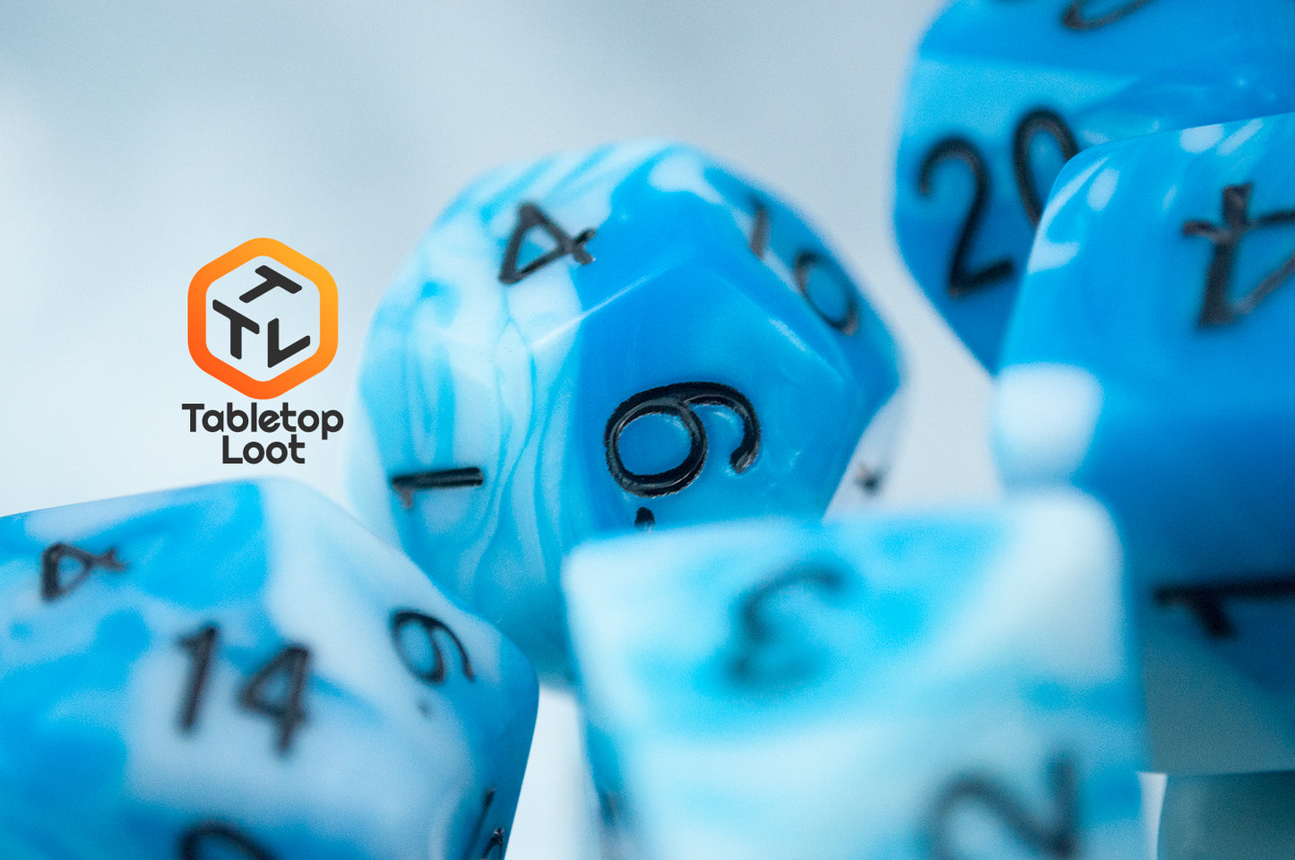 A close up of the D12 from the Cloudy Sky 7 piece dice set from Tabletop Loot with swirls of bright blue and white resin and black numbering.