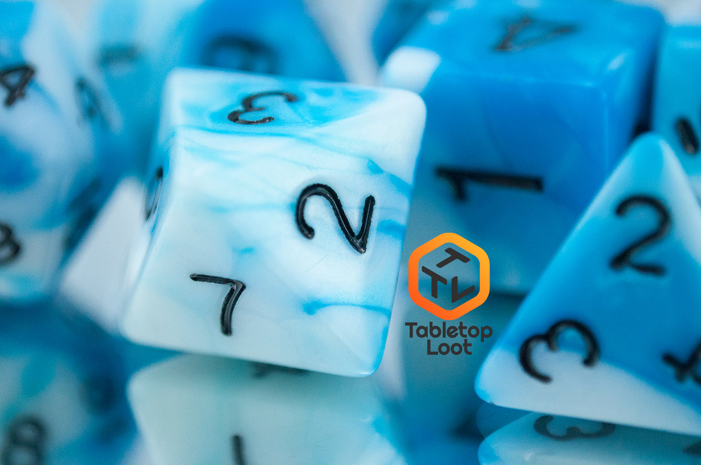 A close up of the D8 from the Cloudy Sky 7 piece dice set from Tabletop Loot with swirls of bright blue and white resin and black numbering.