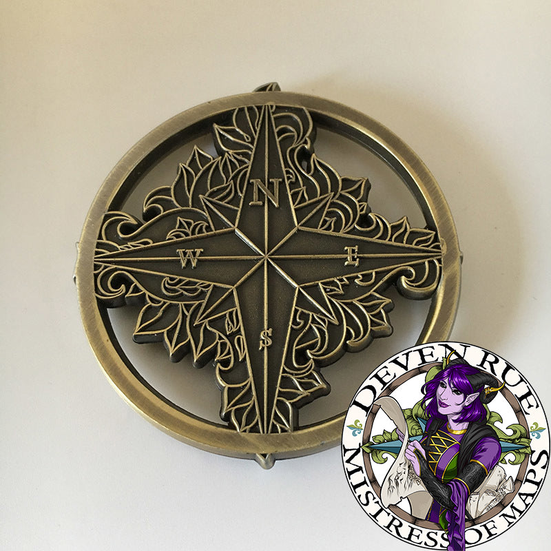 The back of the Compass Rose token map weight by Deven Rue to show the raised details in contrast to the flat relief.