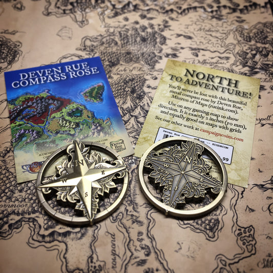 The front and back of the Compass Rose token by Deven Rue to show the differences on each side.