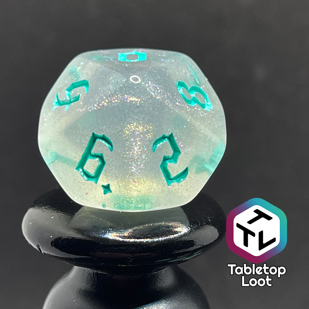 Translucent d10 with iridescent micro-glitter and red numbers.