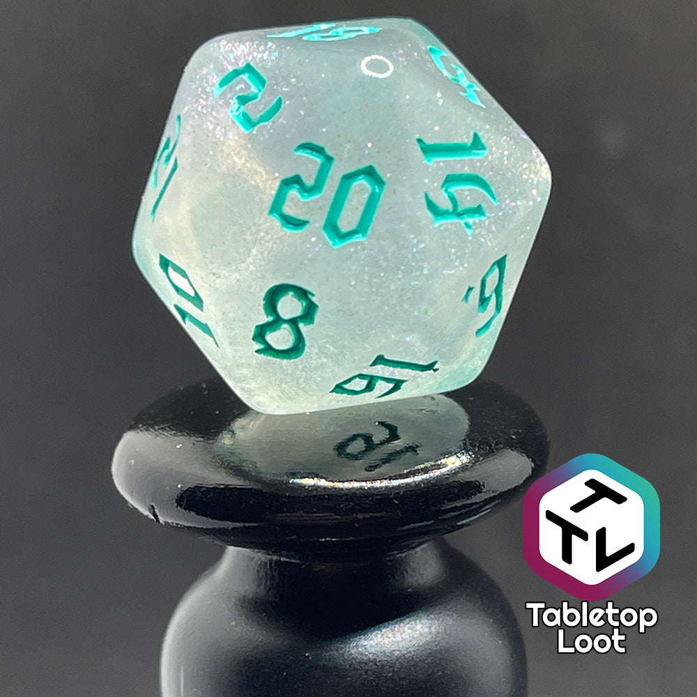 Translucent d20 with iridescent micro-glitter and red numbers.