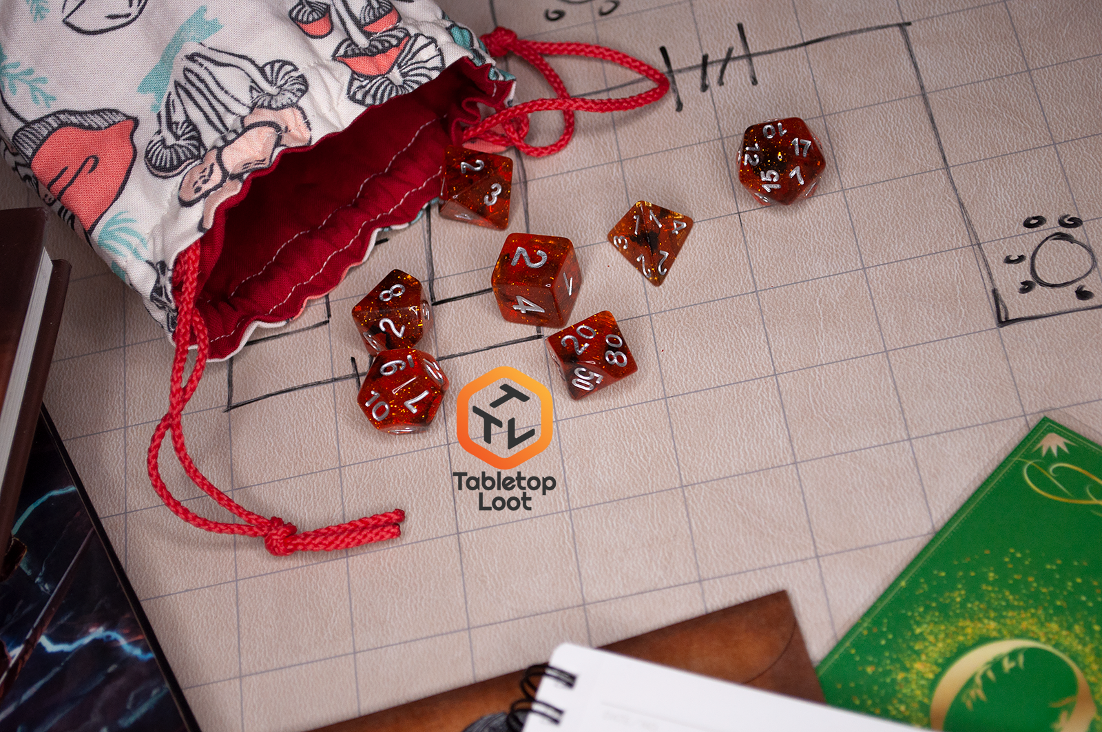 The Dissonant Whispers 7 piece dice set from Tabletop Loot with swirls of black in sparkling amber color, inked in silver, scattered on a gaming table.