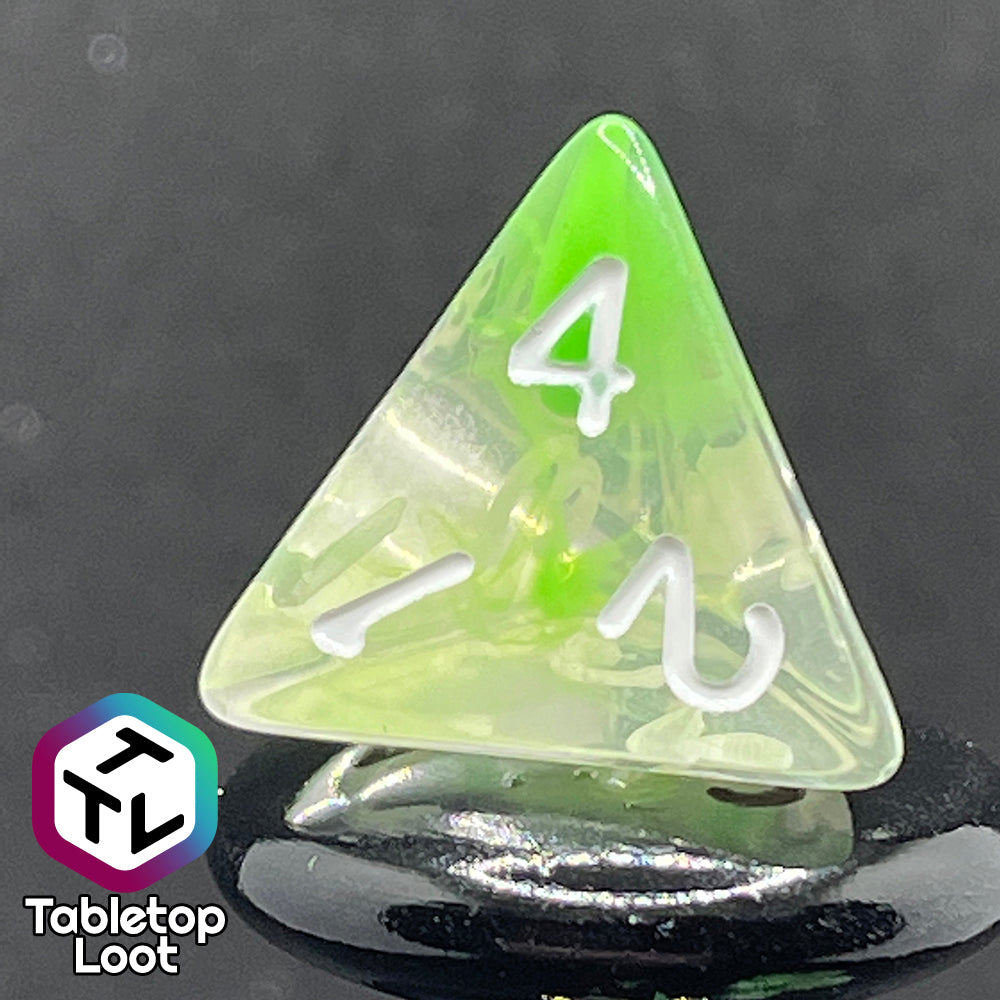 A close up of the D4 from the Ectoplasm 7 piece dice set from Tabletop Loot with swirls of lime green in clear resin and white numbering.