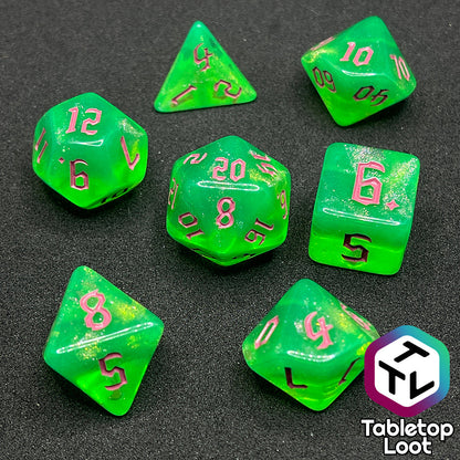 The Sour Apple 7 piece dice set from Tabletop Loot; shimmery green dice with pink gothic numbering.