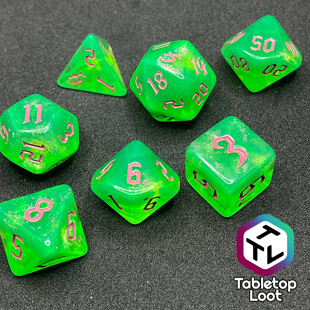 The Sour Apple 7 piece dice set from Tabletop Loot; shimmery green dice with pink gothic numbering.