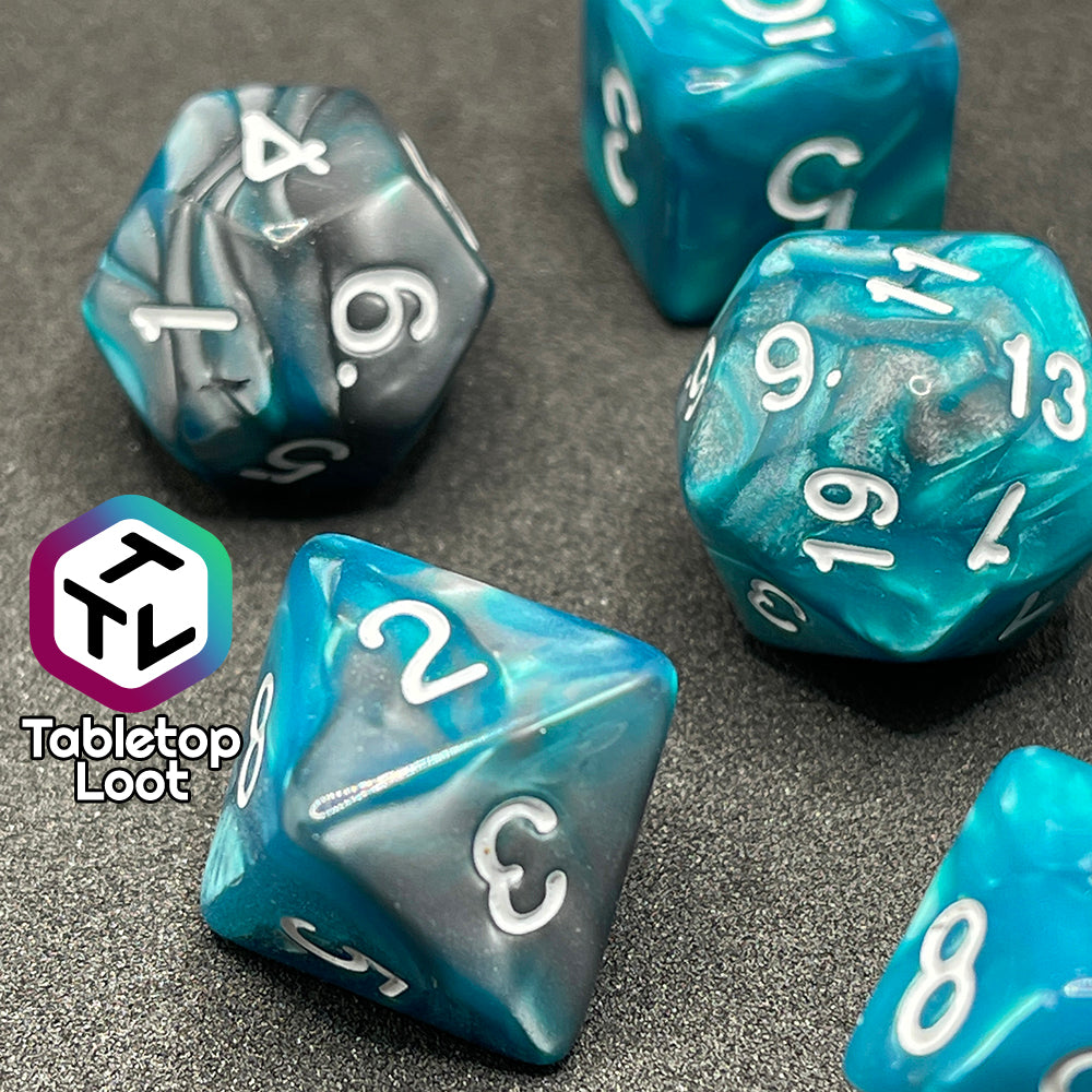 A close up of the D8 from the Hunter's Mark 7 piece dice set from Tabletop Loot with pearlescent swirls of blue and silver and white numbering.