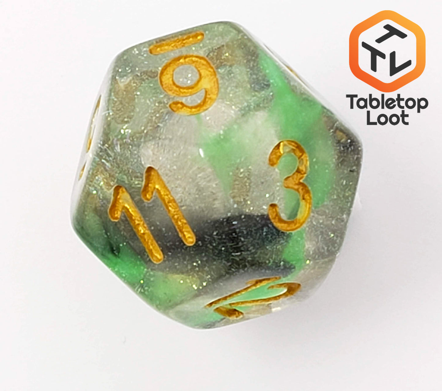 A close up of the D12 from the Luminous Venom 7 piece dice set from Tabletop Loot with green and black swirls in a clear glittery resin with gold numbering.
