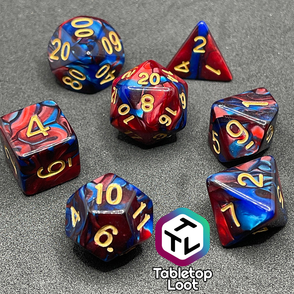 The Metropolis 7 piece dice set with swirls of pearlescent blue and red and gold numbering.