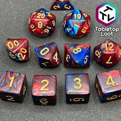 A close up of the Metropolis 11 piece dice set from Tabletop Loot with swirls of red and blue and gold numbering.