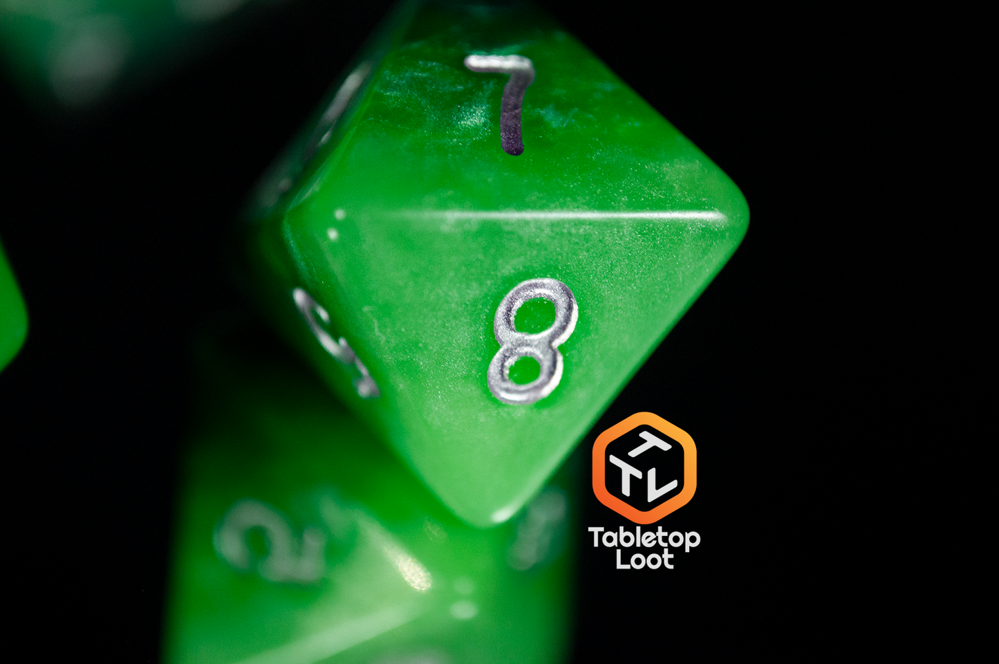 A close up of the Necropolis D8 from Tabletop Loot showing the lightest shade of green and the intensity of the shimmer.