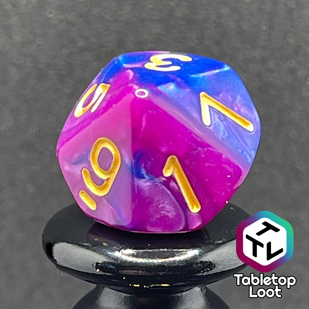 A close up of the D10 from the Spelljammin' 7 piece dice set from Tabletop Loot with pearlescent swirls of purple and blue and gold numbering.