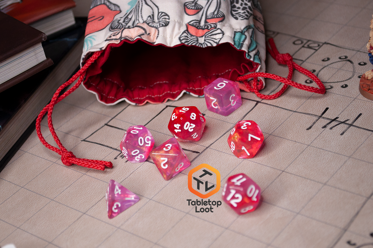 The Pink Bunny 7 piece dice set from Tabletop Loot with yellow and gold shimmer in bright pink resin with white numbering.