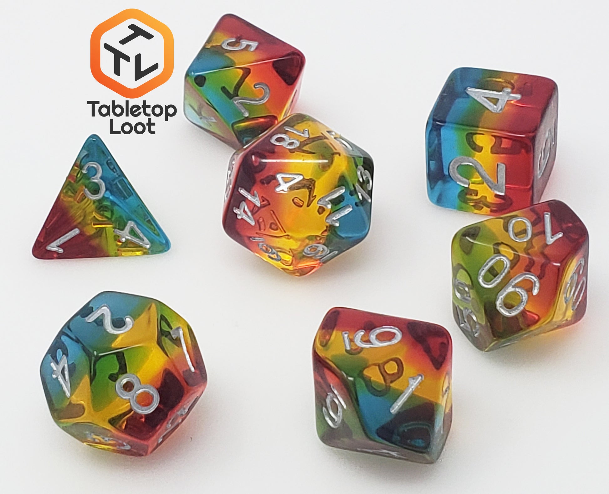 The Dusk 7 piece dice set from Tabletop Loot with blue, yellow, and red layers and white numbering.