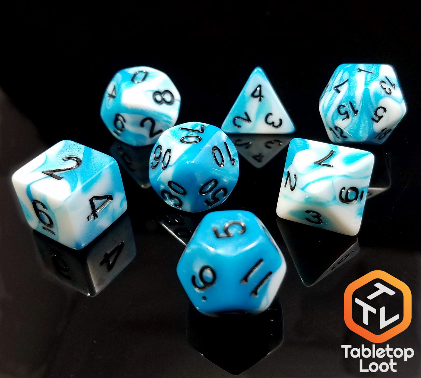 The Cloudy Sky 7 piece dice set from Tabletop Loot with swirls of bright blue and white resin and black numbering.