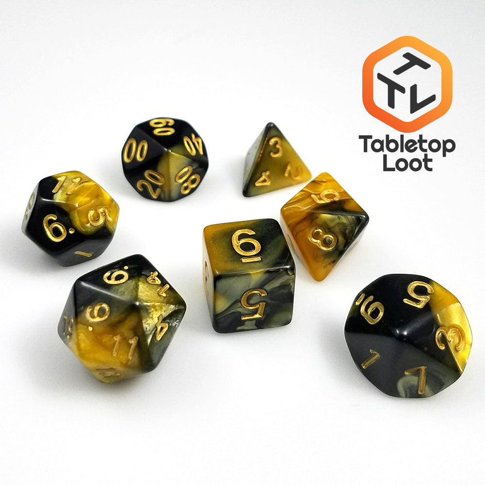 The Hornet Swarm 7 piece dice set from Tabletop Loot with gold and black swirled resin and gold numbering.