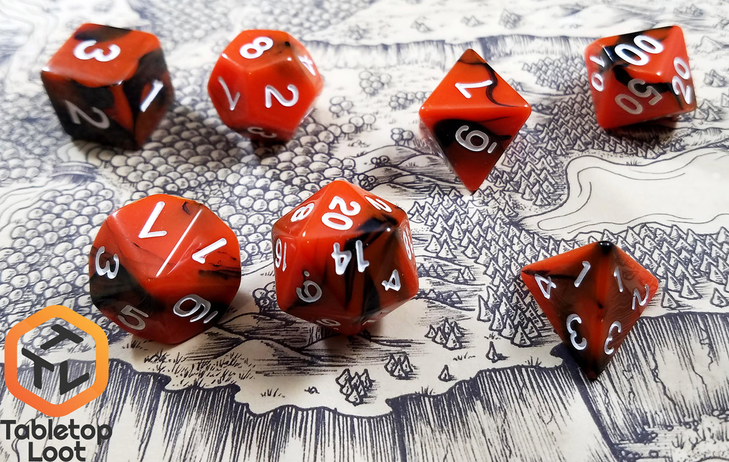 The Lava Flow 7 piece dice set from Tabletop Loot with swirls of black and orange resin and white numbering.