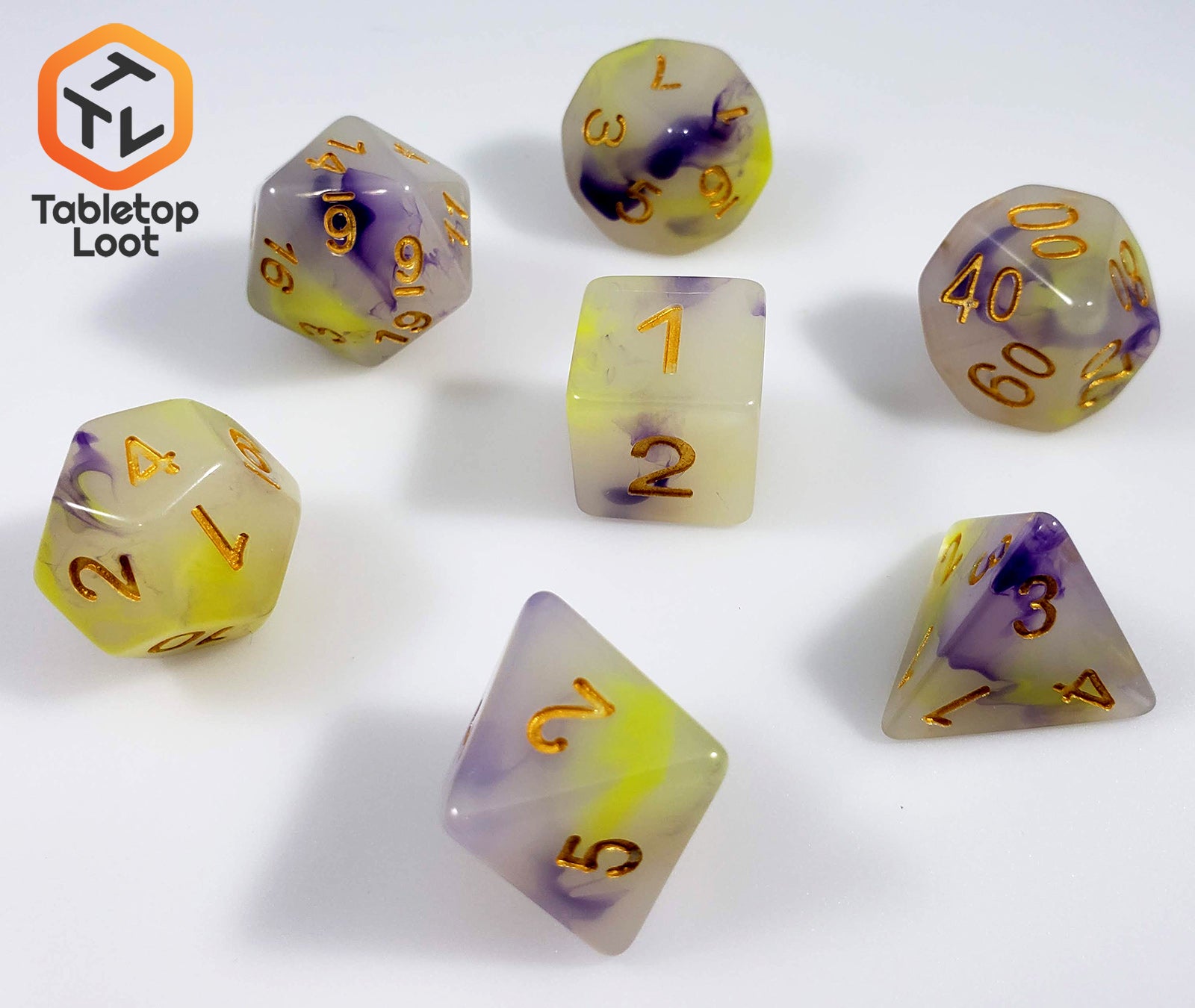 The Fields of Wildflowers 7 piece dice set from Tabletop Loot with swirls of purple and yellow in a milky resin and gold numbering.