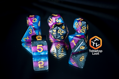 The 7 piece Pulse Wave dice set from Tabletop Loot; striped blue, purple, and black glittery dice with gold numbering.