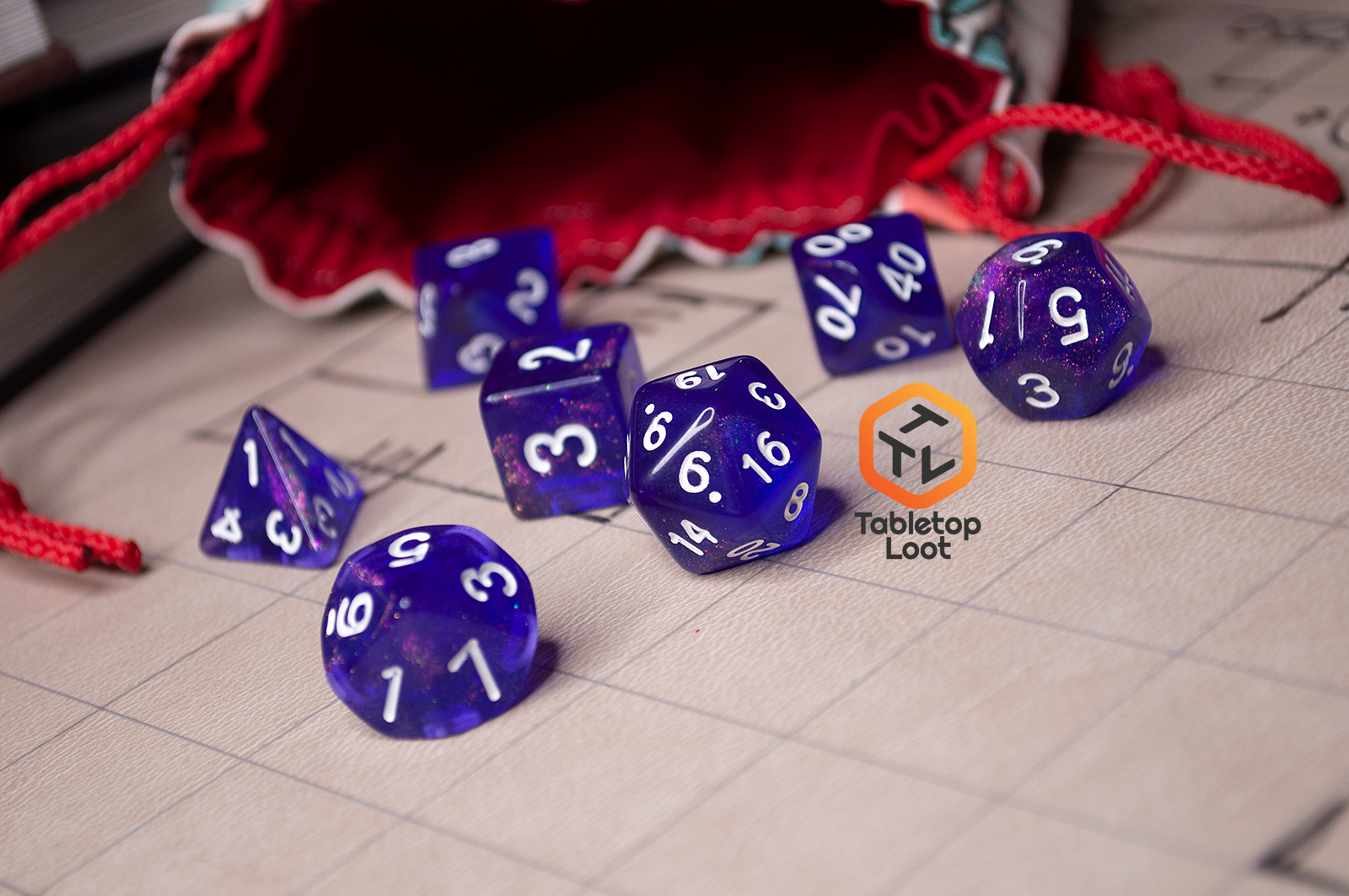 The Diamond Purple 7 piece dice set from Tabletop Loot with purple dice filled with micro glitter and white numbering.