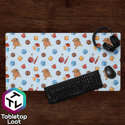 The Loot desk size mouse pad from Tabletop Loot has a pattern of illustrated tabletop trinkets including bags of gold, dice, gems, and potions.
