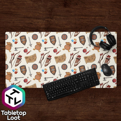 The Adventuring desk size mouse pad from Tabletop Loot has a pattern of illustrated adventuring gear including gems, gold, shields, swords, bows, arrows, quivers, and maps.
