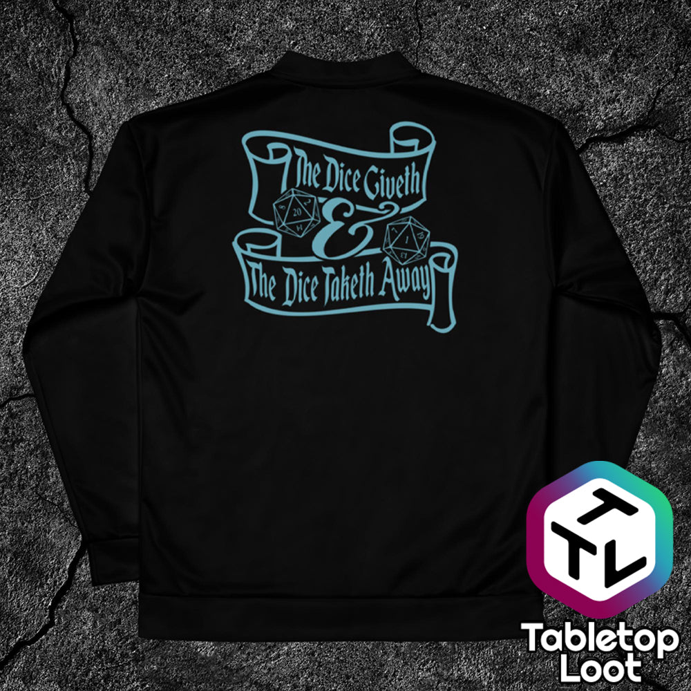 A black bomber jacket from Tabletop Loot has a light blue design with a pair of critical high and low D20s banners that say "The dice giveth & the dice taketh away".